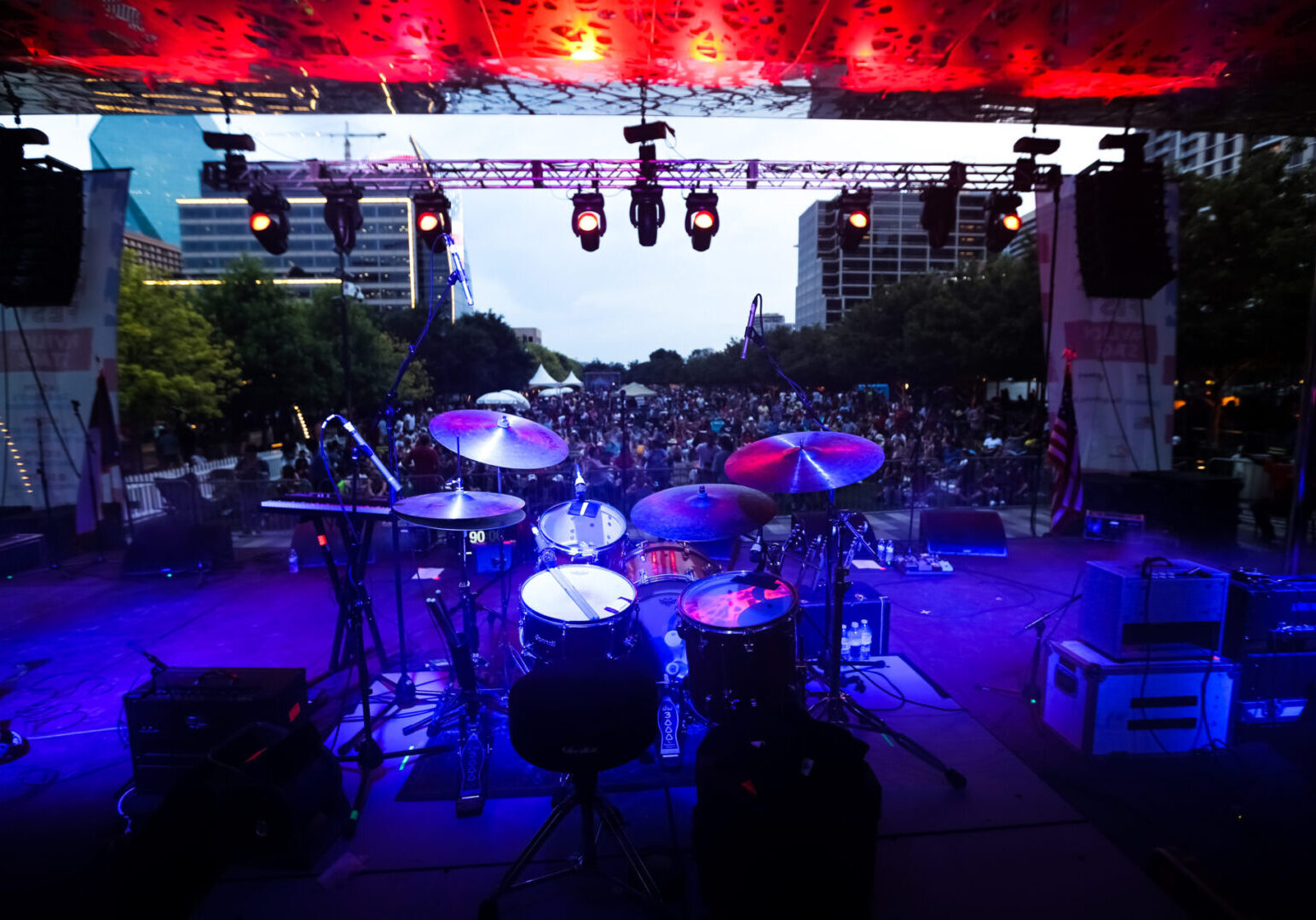 A stage with lights and a bunch of drums